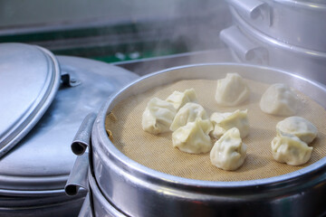 a scene of steaming dumplings