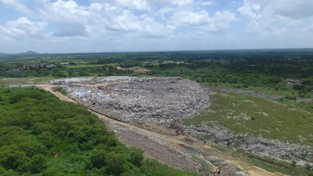 Duquesa landfill seen from drone, Santo Domingo. Aerial forward