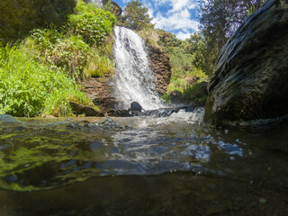 Fototapeta na wymiar Waterfall in a ravine in Sierra Nevada
