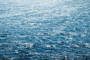 Ocean wave background. Bubble water foam backdrop. Turbulent sea texture. Messy water flow. Ripples on lake water.