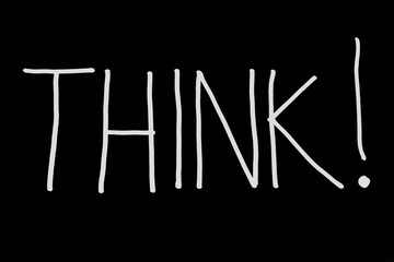 Handwritten inscription Believe in white marker on a black background