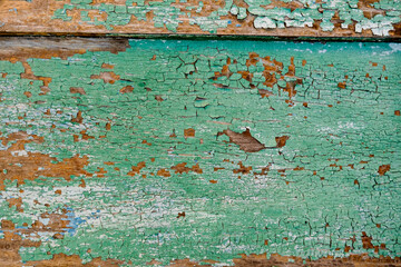 Fototapeta na wymiar Old green board with cracks.