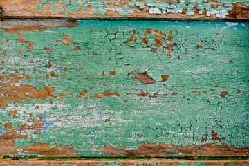 Old green board with cracks.