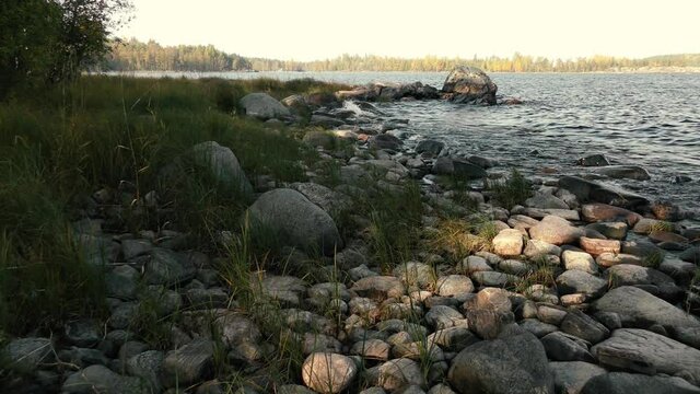 Rocky island, morning light, northern lake. Ladoga, Karelia, Russia