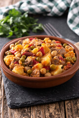 Ropa vieja food in bowl on rustic wooden table	