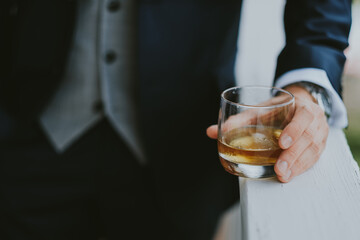 businessman holding a glass