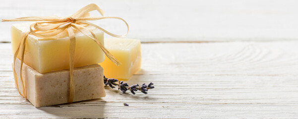 Handmade soaps on white wood table background