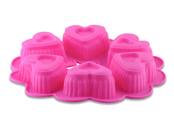 Pink silicone cupcake or muffin form isolated on white background. Cake cup, silicone mold, bakeware.