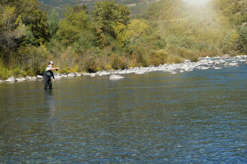Fototapeta na wymiar fly fisherman fishing on the rio Ara in Spain