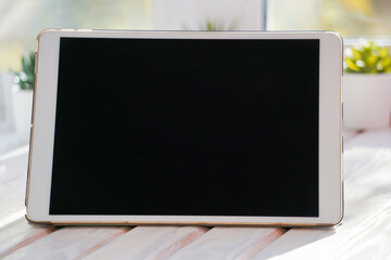 tablet pc on wooden table