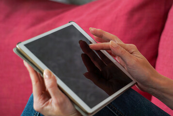person holding tablet pc