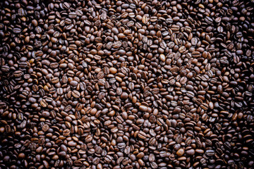 Coffee grinder on coffee bean texture. Coffee background