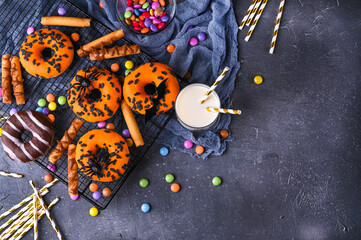 Halloween donuts . Sweet pastries decorated for a horror party. Copy space. Top view. High quality photo. High quality photo