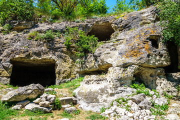 'Windows' of living caves inside ancient city Chufut Kale, Bakhchisaray, Crimea. In medieval they used as storages, stores & even homes for local villagers
