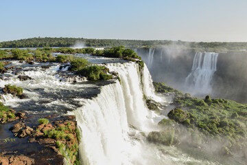 The stunning Iguazu Falls seen from above in a beautiful day with blue sky. Foz do Iguaçu, Brazil.