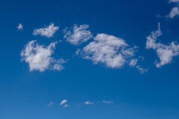 Obraz na płótnie Canvas White clouds in the blue sky. A beautiful view of natural nature.