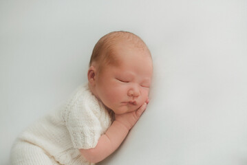 portrait of a little infant newborn baby: baby's face close-up. concept of childhood, healthcare, IVF
