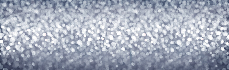 Christmas gray bokeh background. Celebration lights background.