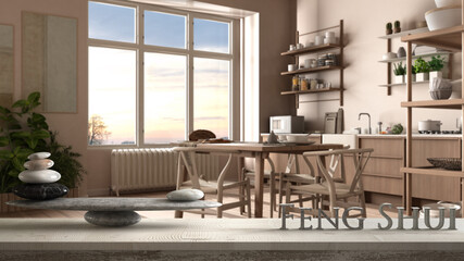 Wooden vintage table shelf with pebble balance and 3d letters making the word feng shui over country rustic wooden kitchen with dining table and shelves, zen concept interior design