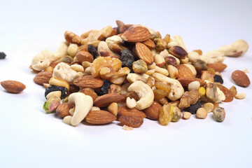Close up of mixed nuts on white background 
