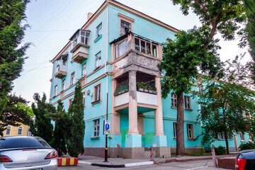 Residential house on street of Kerch (Crimea) with an unusual annex in the form of columns and balconies