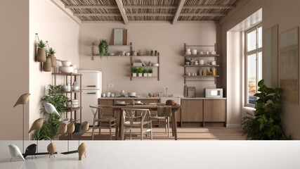 White table top or shelf with minimalistic bird ornament, birdie knick - knack over blurred country rustic kitchen, dining table, chairs, shelves, appliances, modern interior design