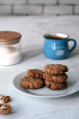 Cosy homemade oatmeal cookies and a cup of coffee