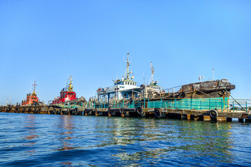 Sea boats moored to their pier. Shot in Kerch, Crimea
