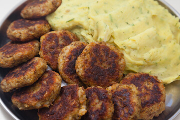 Closeup of plate with cutlets and mashed potatoes 