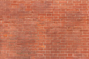 Surface of a red brick wall.
