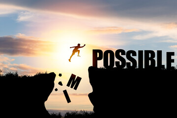 Mindset concept ,Silhouette man jumping over impossible and possible  wording on cliff with cloud sky and sunlight. - obrazy, fototapety, plakaty