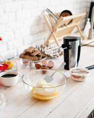 Kitchen interior with gift boxes, eggs and cooking unensils