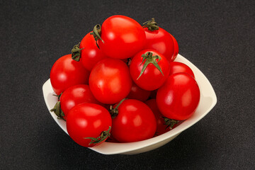 Ripe juicy cherry tomato in the bowl