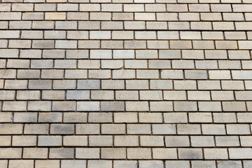 Surface of a yellow brick wall.