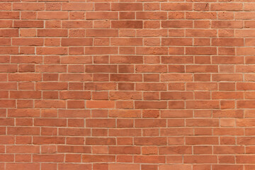 Surface of a red brick wall.