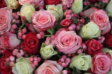 Pink and purple roses in a big wedding centerpiece
