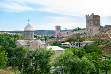 Fototapeta na wymiar Panorama of main remains of Genoese fortress in Feodosia, Crimea. On foreground located church of St. John The Baptist. All these sights were built in XIV century
