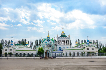 Fototapeta na wymiar Panorama of church of St. Catherine in Feodosia, Crimea. This is one of most attractive temples in city as it's very graceful & colorful. It was founded in 1892