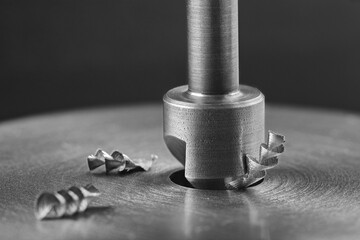 Countersink drill bit make sink in hole in steel billet. Locksmith work.
