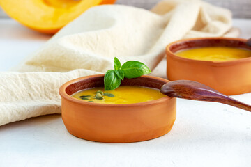Pumpkin cream soup with pumpkin seeds in a bowl.Selective focus.