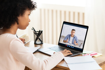 Girl Having Online Class With Teacher Via Laptop At Home