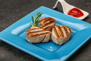 Grilled pork medallion with sauce