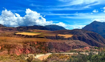 Colorful landscape of El Valle de Sagrado in Peru, Cuzco region. Spectacular Sacred Valley surrounded Andes mountains. Scenic road to Salineras de Maras.