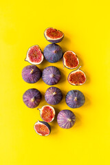 Pattern of whole and sliced figs. Overhead view