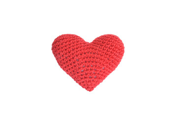 Product knitted from red yarn in the shape of a heart isolated on a white background.