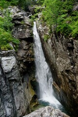 Fototapeta na wymiar Mountain river and waterfall in High Tatras National Park, Slovakia