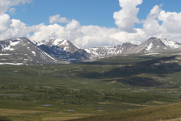 Fototapeta premium mountain landscape of taiga mountains and blue sky