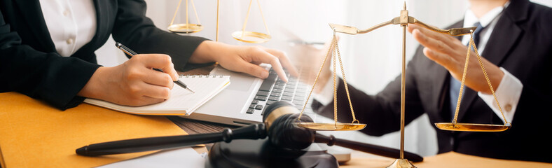 justice and law concept.Male judge in a courtroom on wooden table and Counselor or Male lawyer...