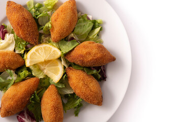 Traditional lebanese kibbeh isolated on white background. Top view. Copy space	