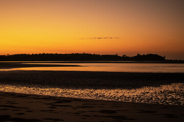A sand beach during low tide and sunset near Ngwesaung, Myanmar